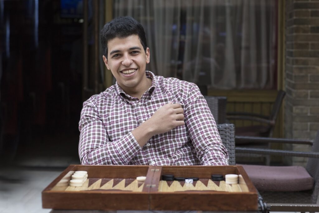 Young Man Playing Backgammon