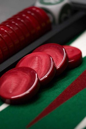 The U.S. Backgammon Federation Official Website Image of a green backgammon board with red checkers.